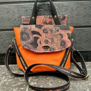 welkin bag in orange with black backpack straps