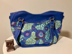 Blue aboriginal waterway fabric on a blue hireath bag