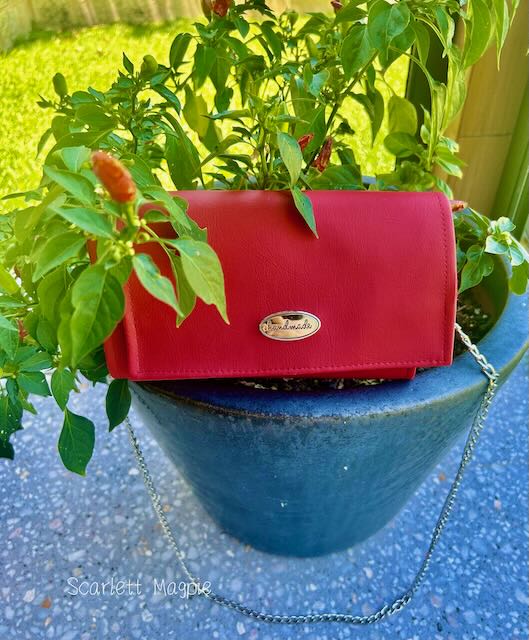 faux leather clutch handbag in brilliant red