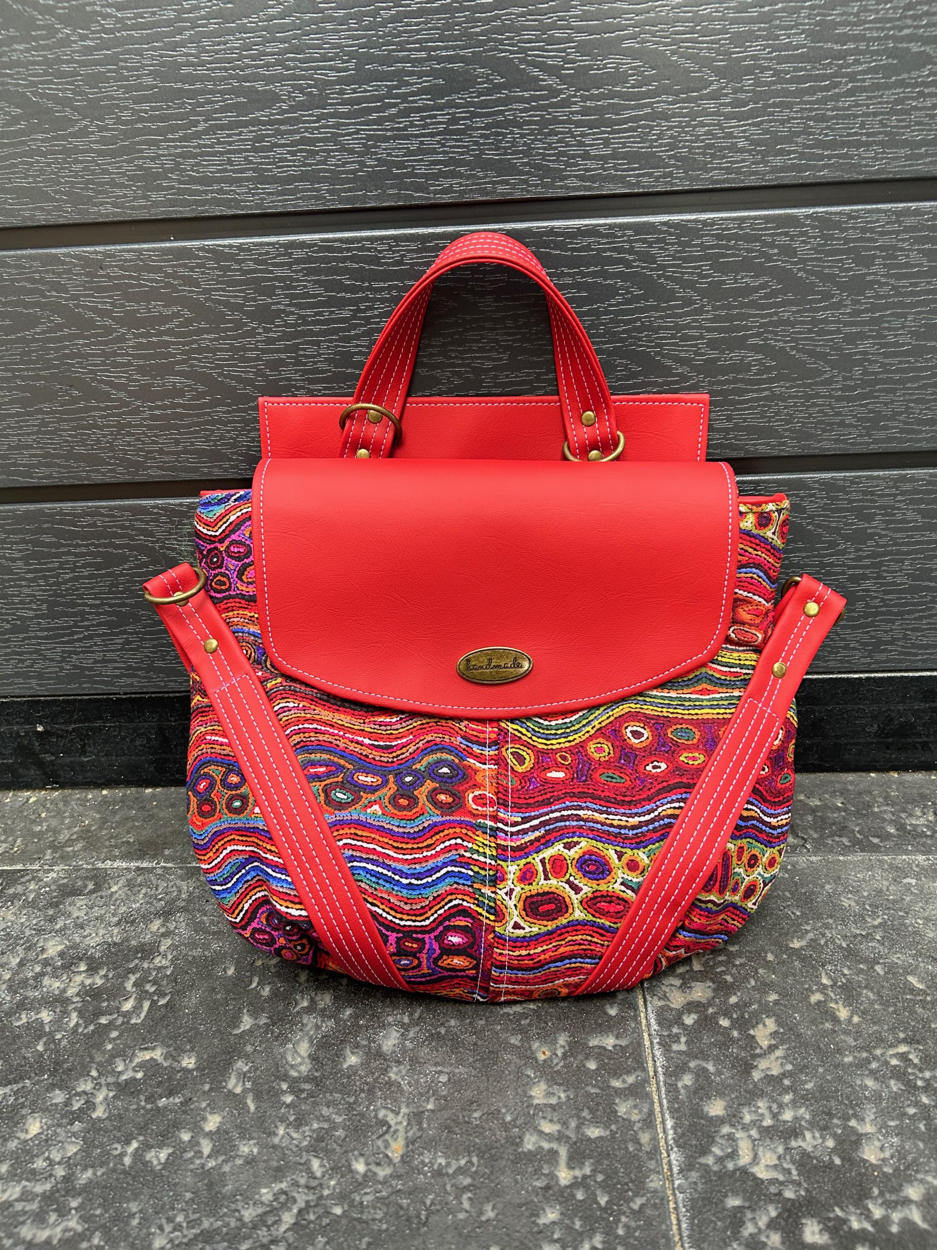 Welkin bag in red leatherette and aboriginal print canvas